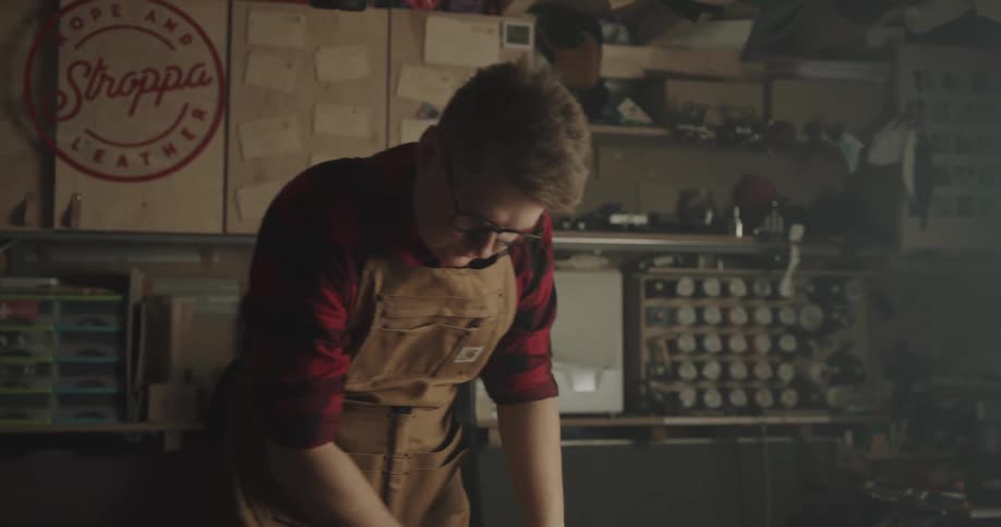 A man unrolling paper