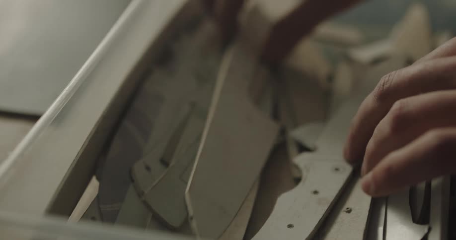 A person is looking at outlines of paper