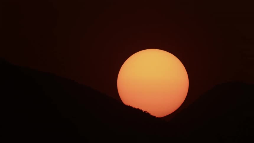 The sun is setting in the atmosphere