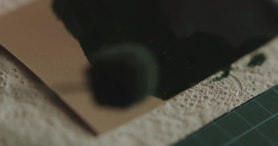 Close up of a paint brush as paint is applied