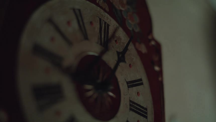 A clock rotating in front of a light source