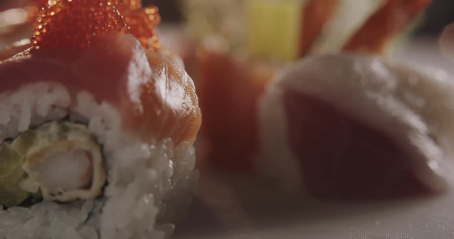 Sushi rolls topped with salmon and roe