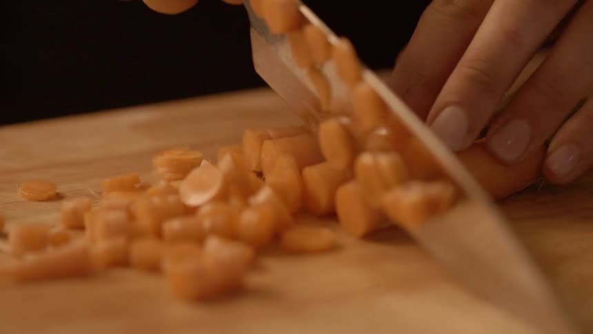 Vegetables are diced on a cutting board