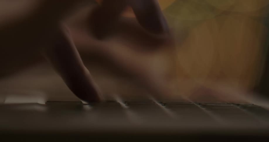 Woman typing on her laptop