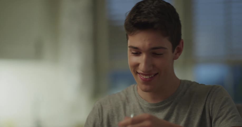 A teenager is having breakfast at home
