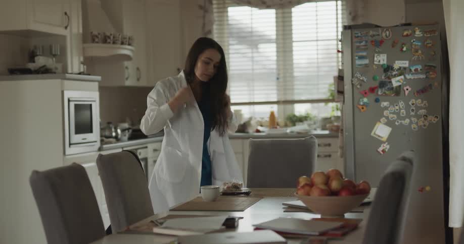 A doctor getting ready for work