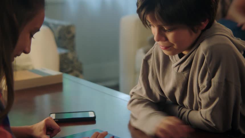 Two people playing witha phone
