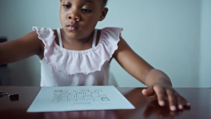 A child writing on a paper
