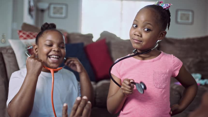 Two children are playing with stethoscopes