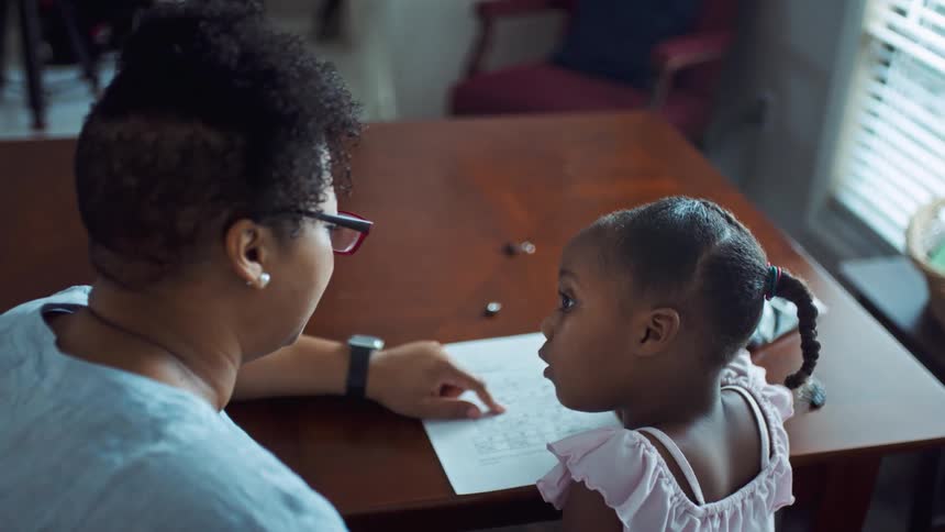 Two people working on a paper