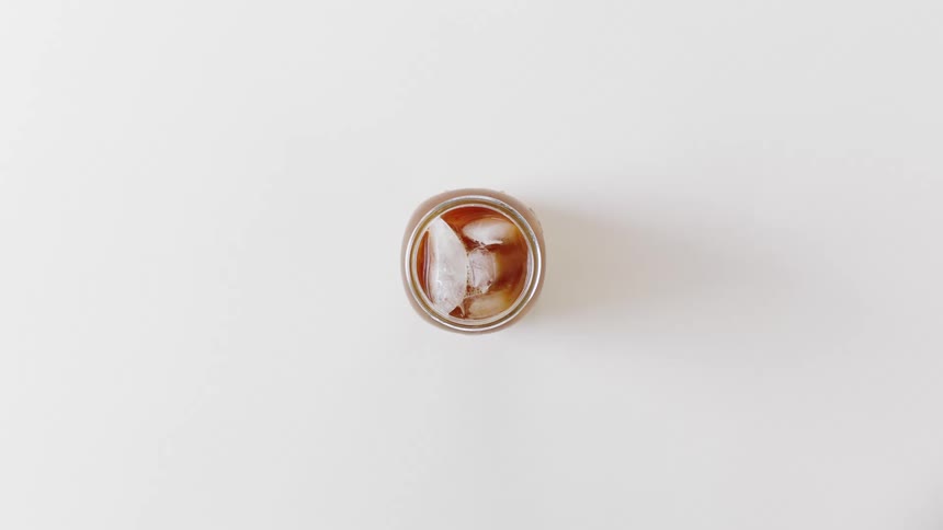 Full open container sits on white surface