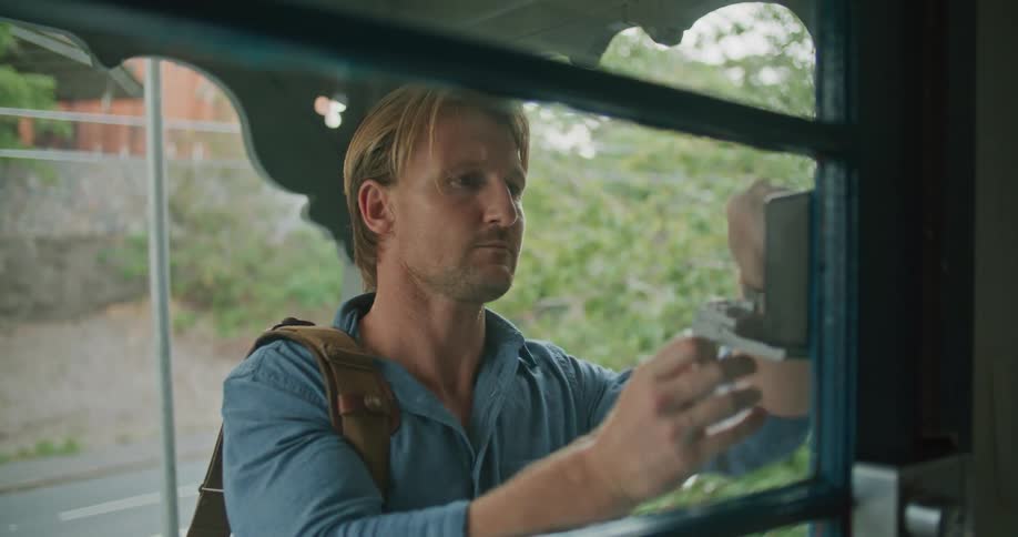 A man unlocking a door