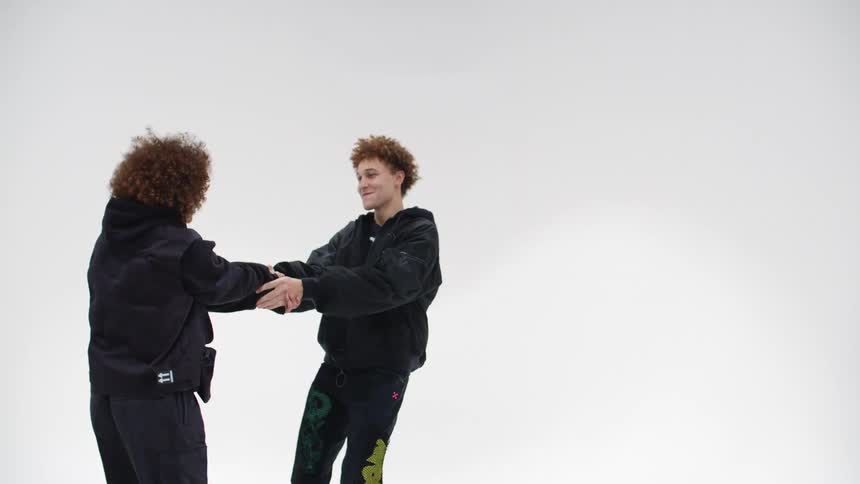 A man and woman are dancing indoors together