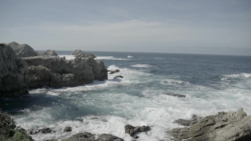 Water coming ashore in a rocky area