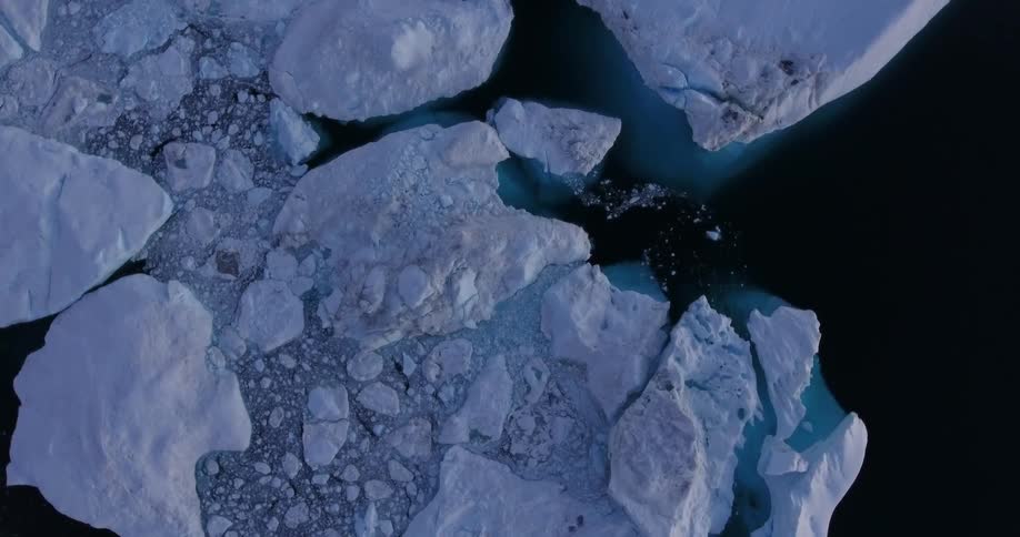 A birds eye view of icebergs in the water