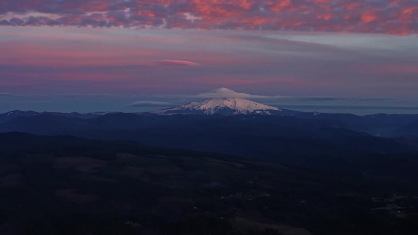Blue hour vibrant sunset with stunning colors of Mount Hood as seen from the air high above Portland Oregon
