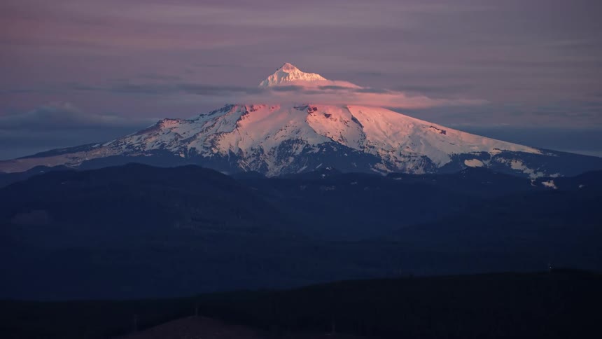 Mount Hood covered in hues of purple, pink, orange and violet deep in the winter months near Portland, Oregon