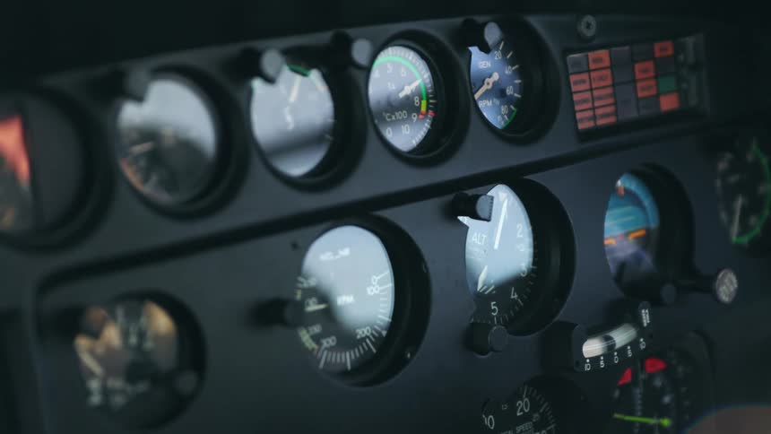 Close up of the dials on the control panel of a helicopter during flight