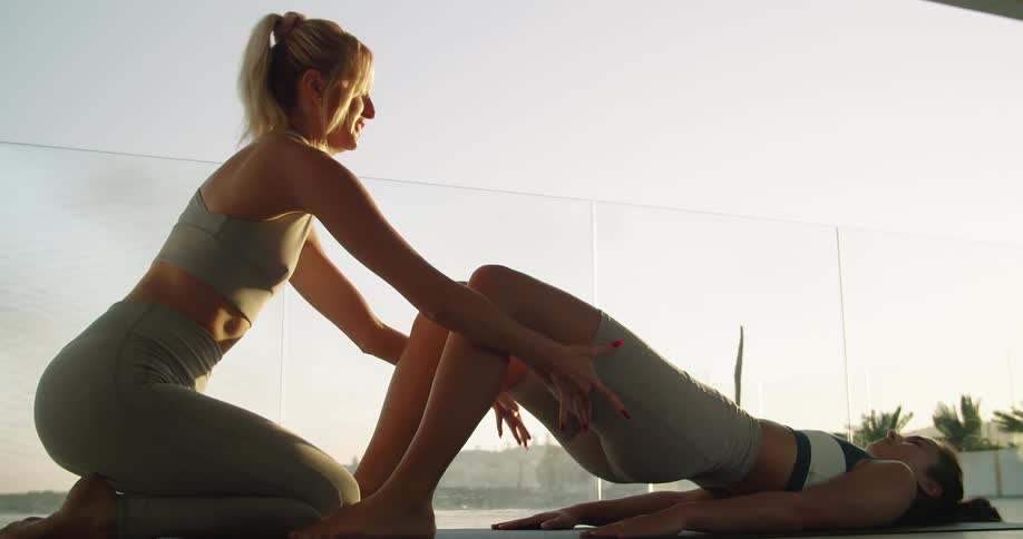Two people doing yoga and stretching