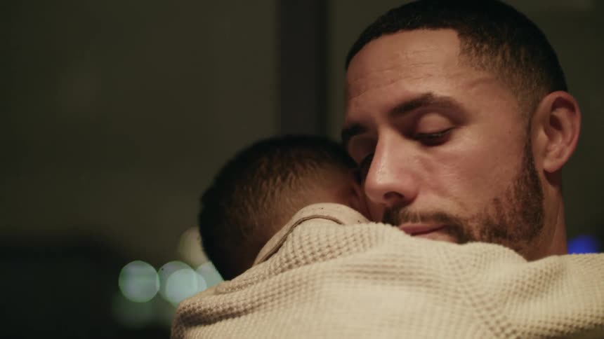 A father holding his son
