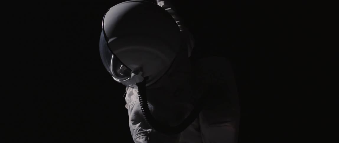 An astronaut floating in dark space