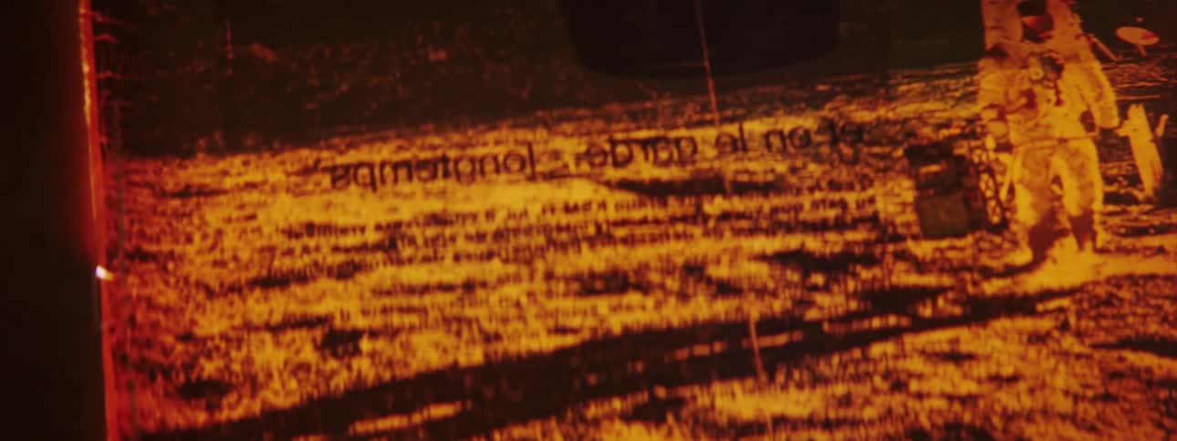 A negative is being viewed on the light