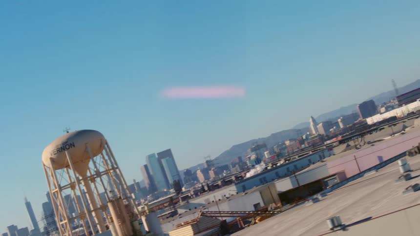 A large water tower is on the building