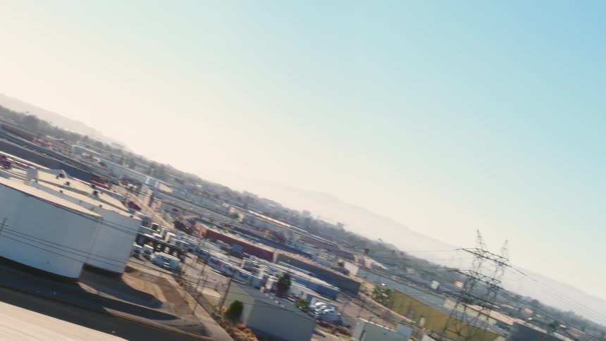 An aerial view of buildings and a refinery