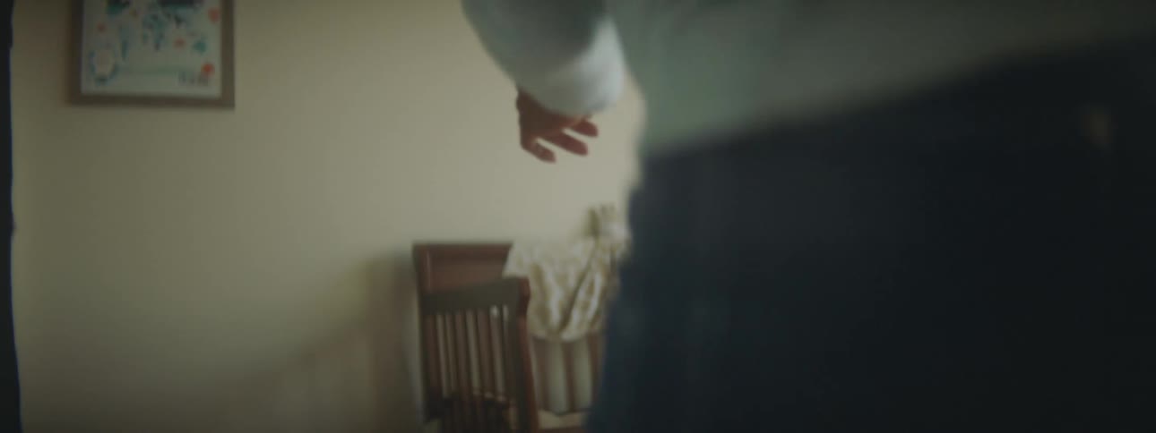 Mother chasing her son into his bedroom with a crib