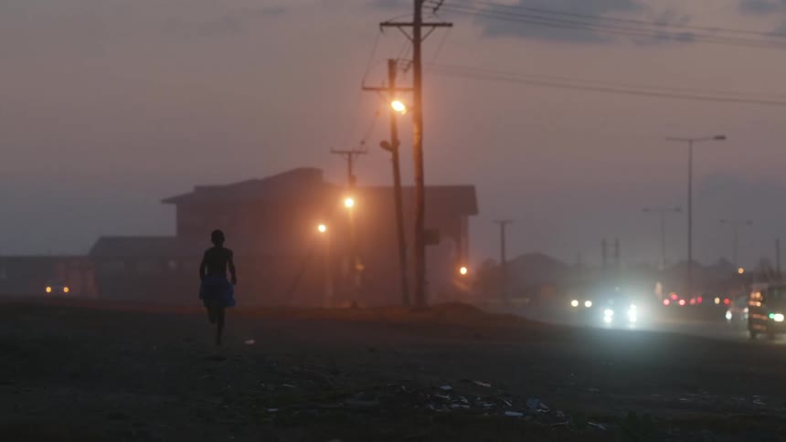 A child running down the side of the road