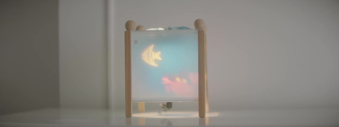 An ocean scene being projected onto a nursery nightlight