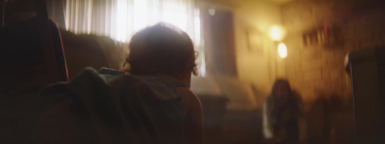 A child crawls towards her mother