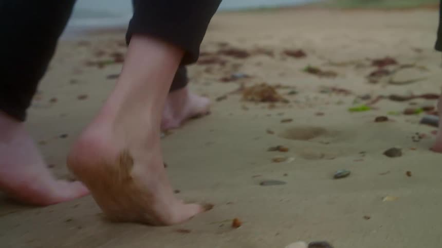 Couple walking on the beach together