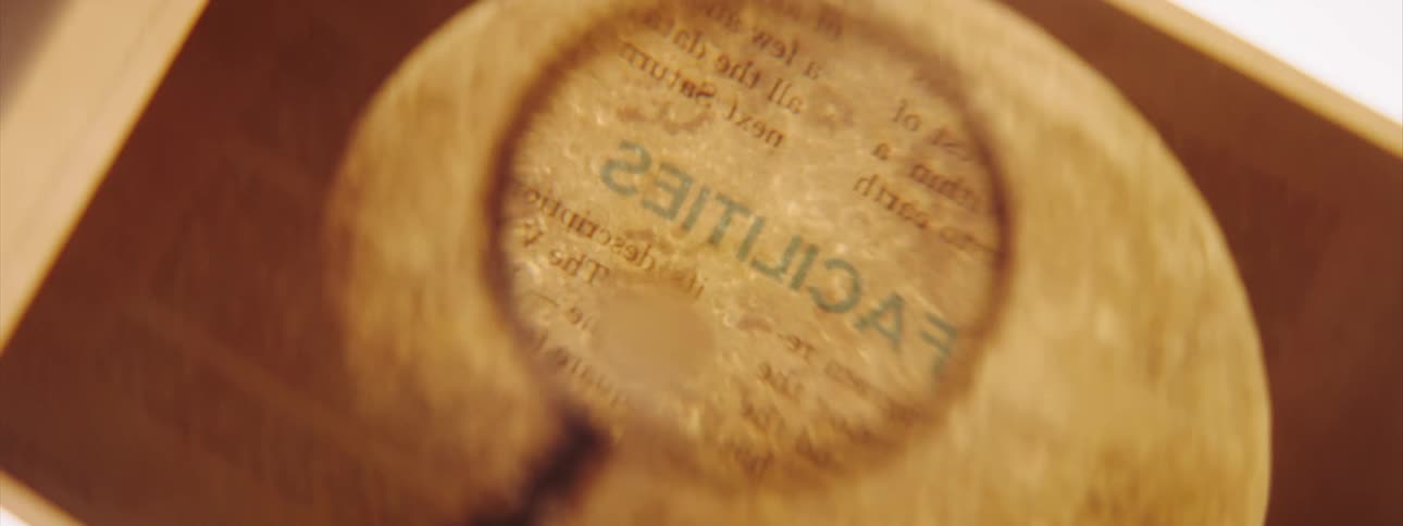 A magnifying glass moving over text