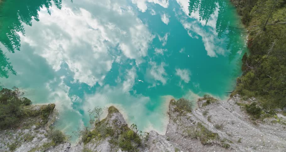 Clouds reflecting on the water in a caldera lake