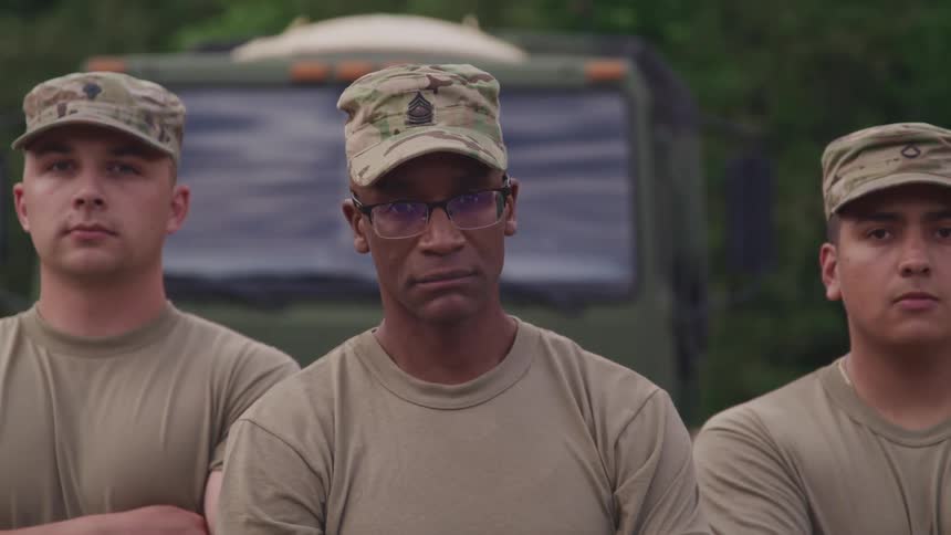 Soldiers stand in line outside