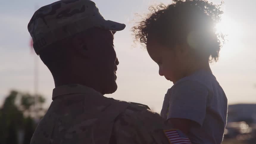 A father holding his daughter