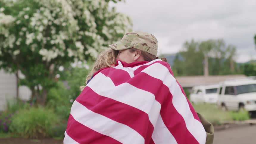 A mother hugging her daughter