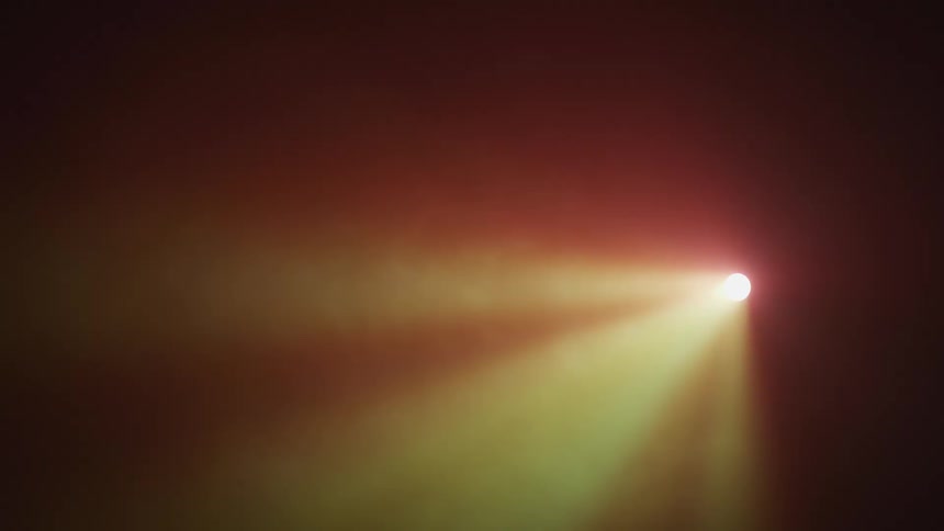 A spotlight in the dark with flair