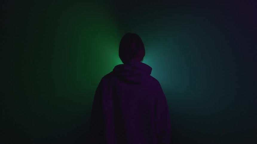 A person is standing while lights are flashing