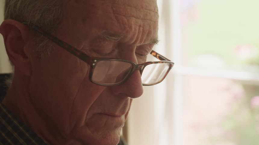 A man is resting by the window