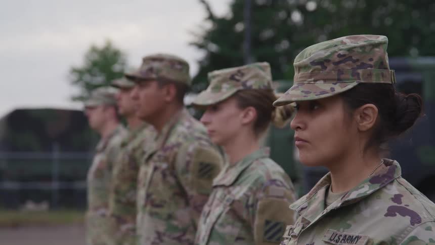 Troop of american soldiers stand firm on a drill exercise in the yard