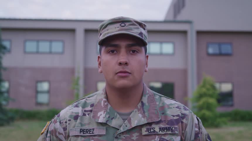 A portrait of a soldier staring at the camera