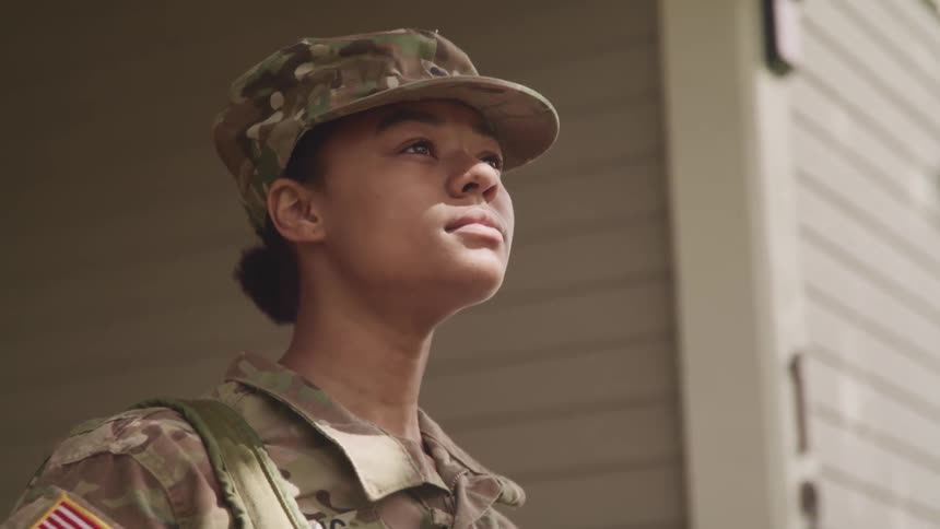 A female soldier looking upwards