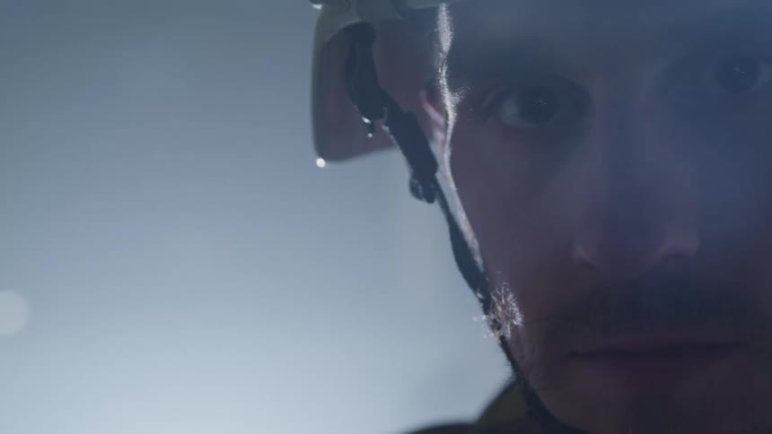 A man is wearing a bicycle helmet