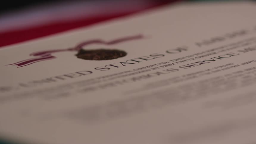 A government document is displayed on a table