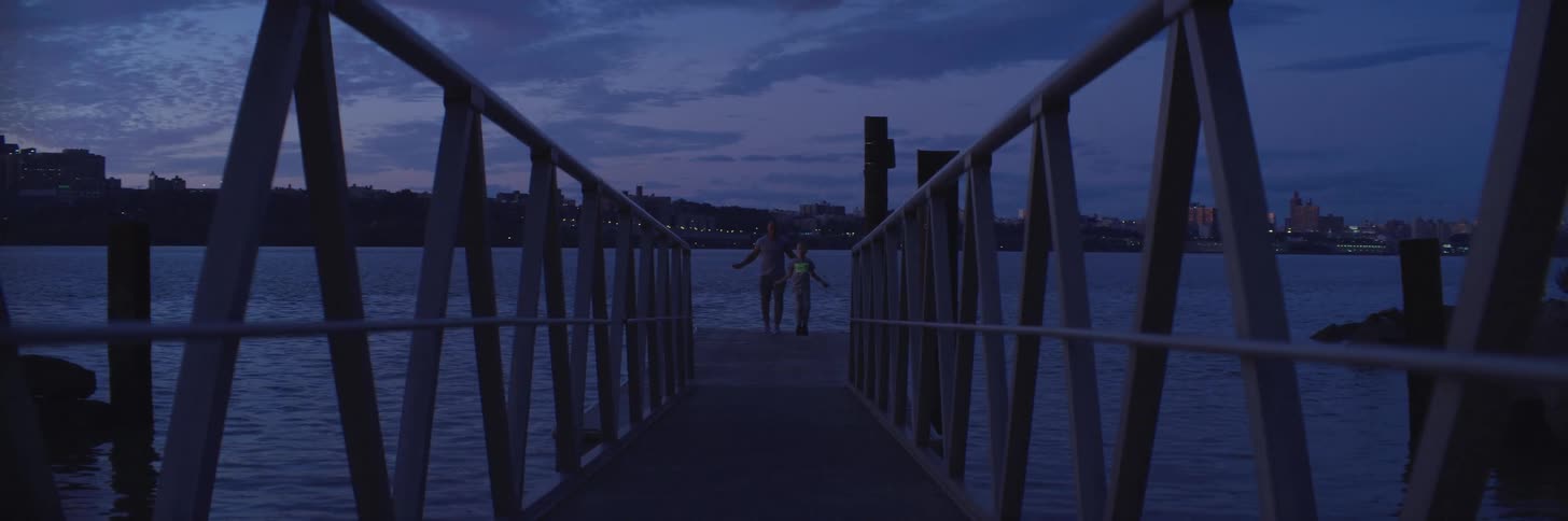 Two people are jumping rope on the pier
