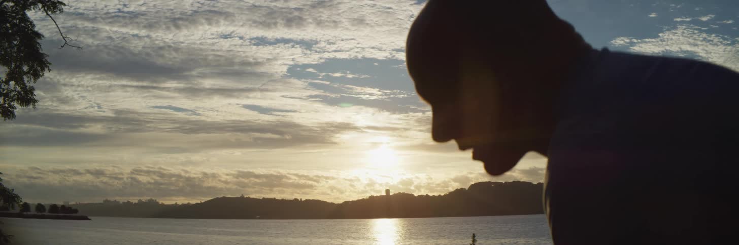 A man exercising on the shore