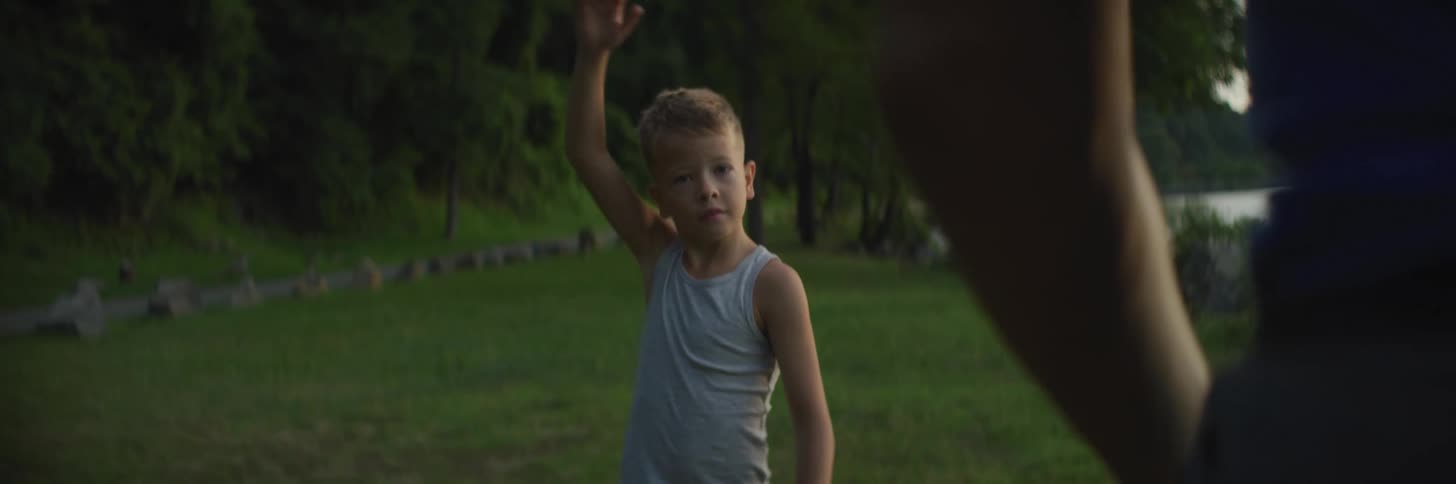 A child stretching in a field