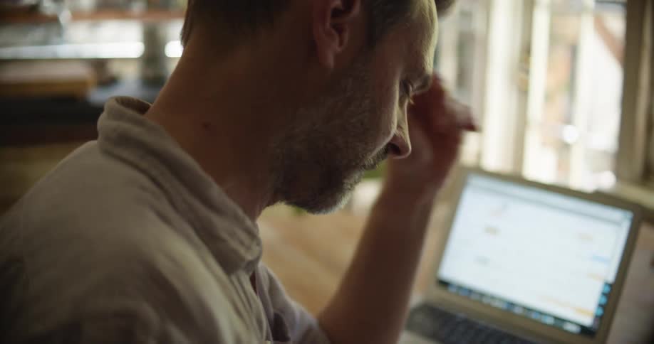 A man working on paperwork at a desk